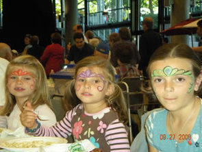 Children with faces painted, photo